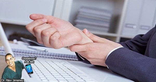 blog picture of lady at her desk grabbing her wrist in pain