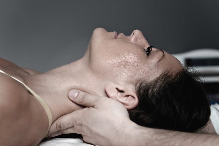 blog picture of close up of lady on table getting neck adjustment