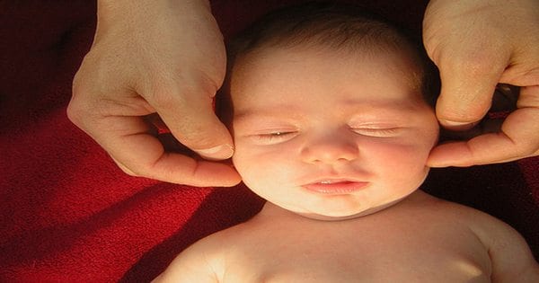 blog picture of baby being adjusted by chiropractor