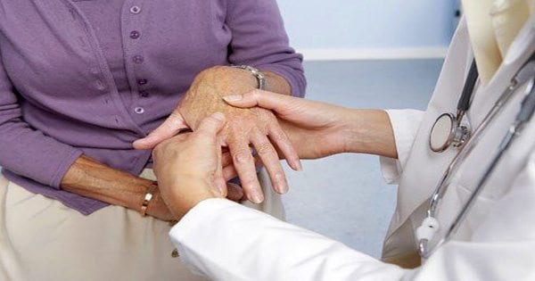 blog picture of lady at doctors office getting her hands checked
