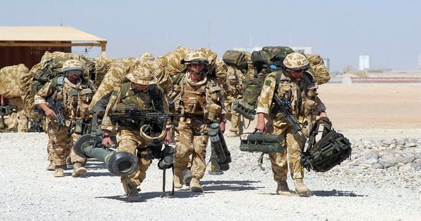 blog picture of marines carrying all their equipment