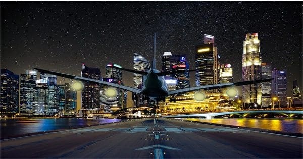 blog picture of airliner landing in big city