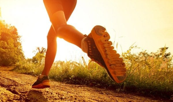 blog picture of lady's legs and feet as she runs on a trail with the sun rising