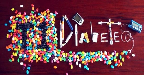 blog picture of table with jelly beans and needles glucose meters and diabetic tools that spell out type I diabetes