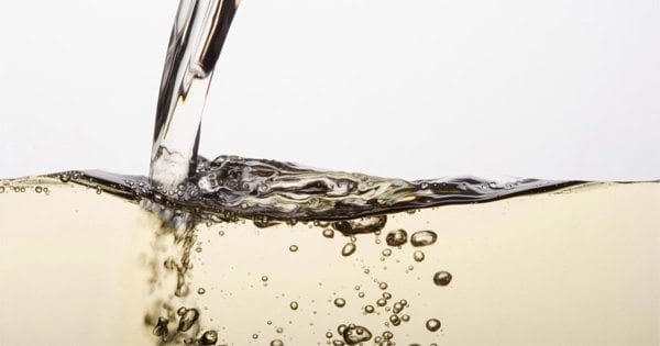 blog picture of white wine being poured