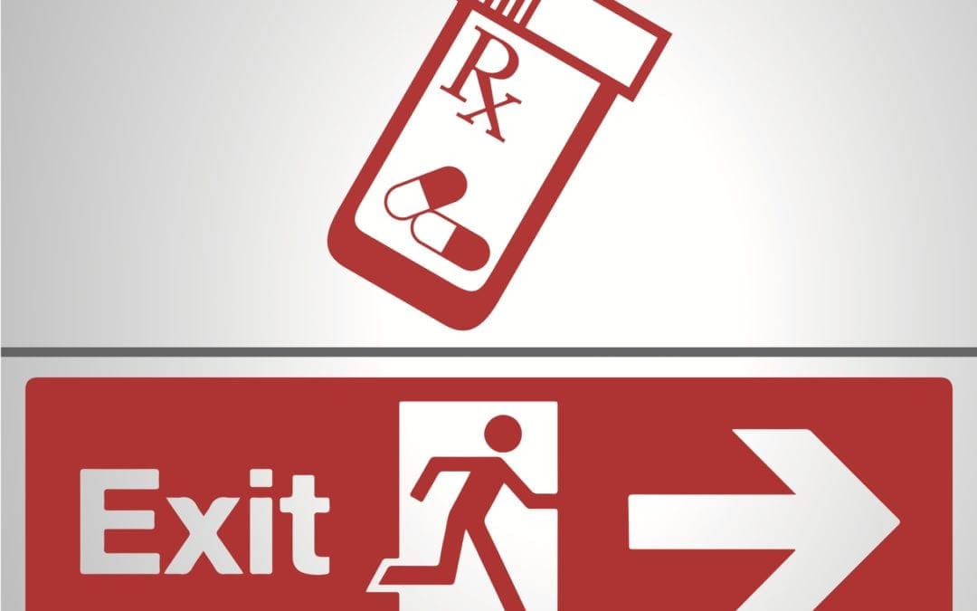 bottle of opioids and an exit sign