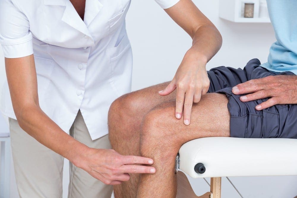 Image of a doctor using physical therapy to treat a patient's sciatica.